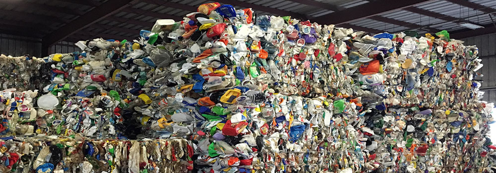 commingle-plastic | Quincy Recycle Large bales of multi-color commingled plastic material.