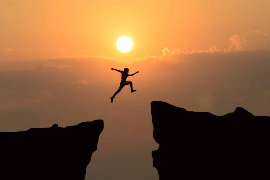 Man,Jump,Through,The,Gap,Between,Hill.man,Jumping,Over,Cliff | Quincy Recycle