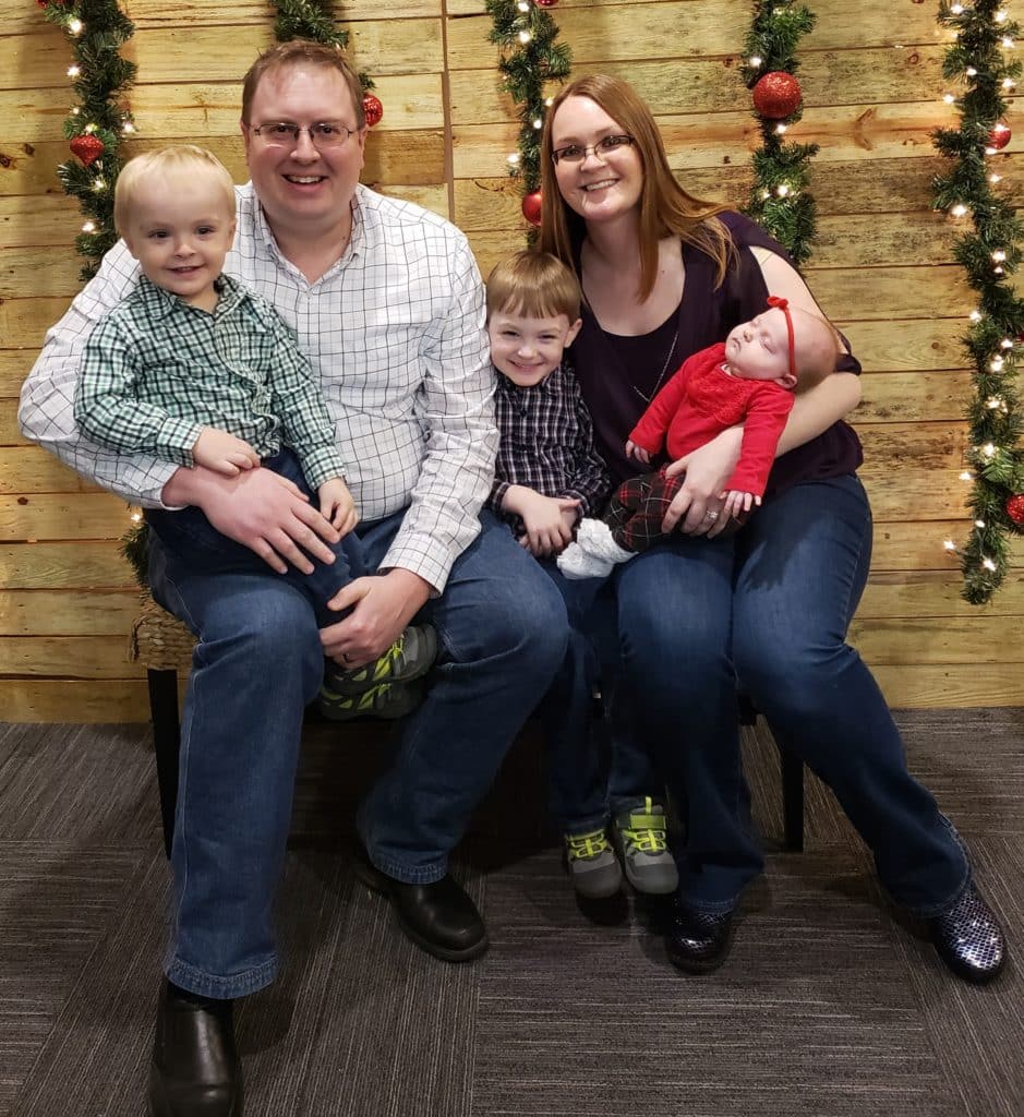 Photo of Matt Garmer with his family posing for a Christmas picture