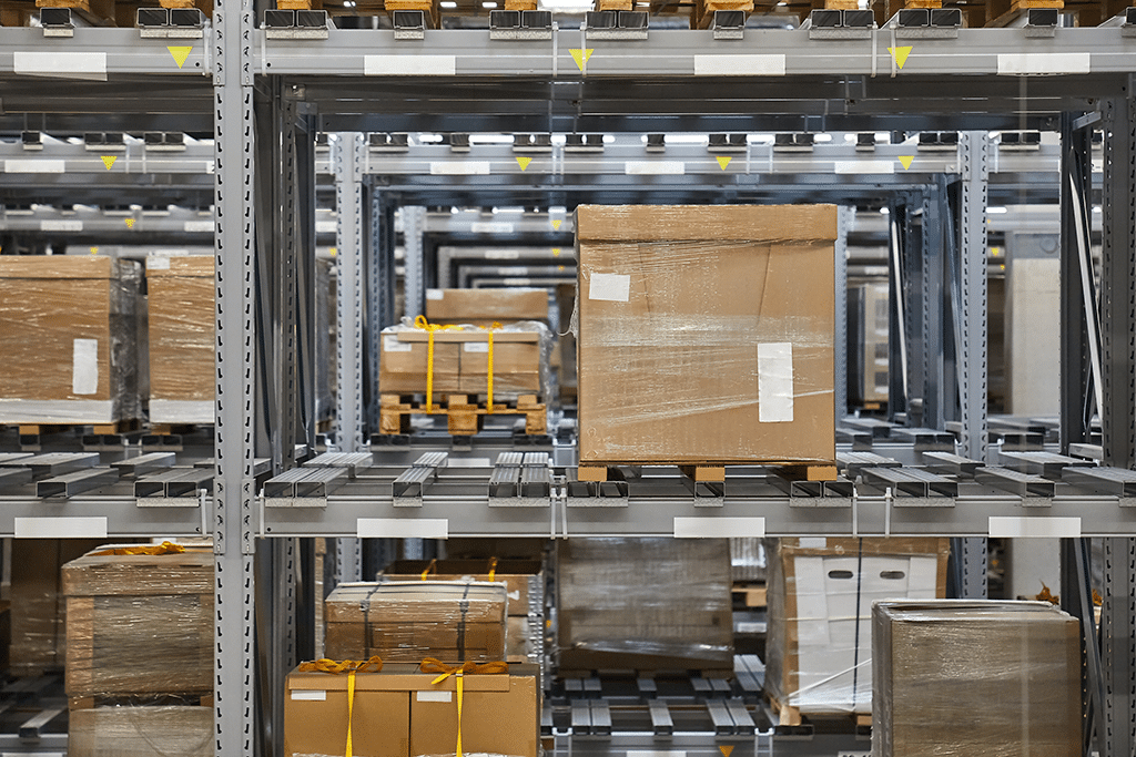 Gaylord boxes stored on racks of metal shelving